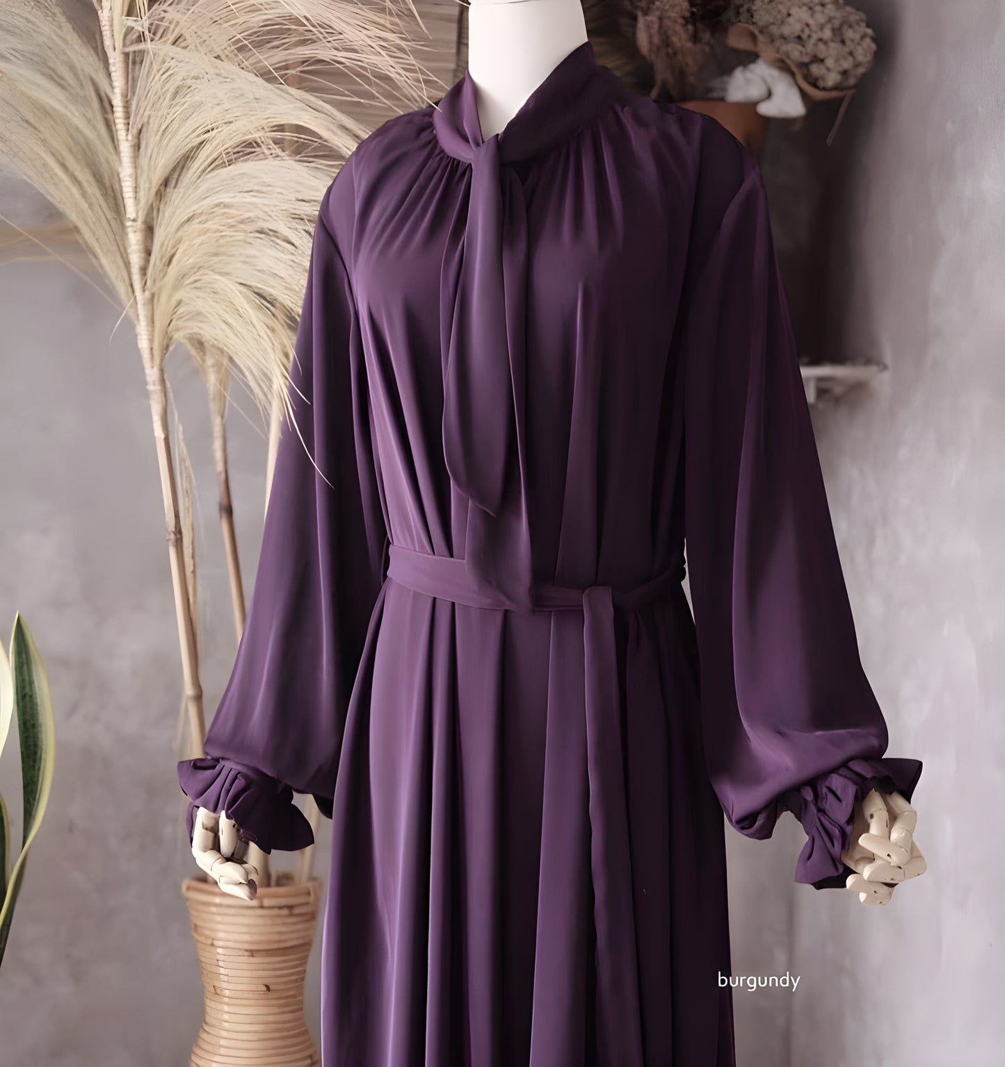 The detail of Abaya Nourah Series in Burgundy color.